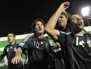 Lionel Messi (C) and midfielder Javier Mascherano celebrate at the end of their FIFA World Cup South Africa-2010 qualifier football match against Uruguay